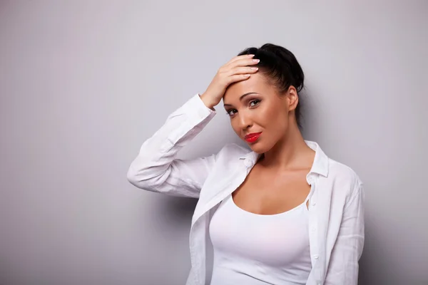 Cheerful young woman is strongly ashamed of something — Stock Photo, Image