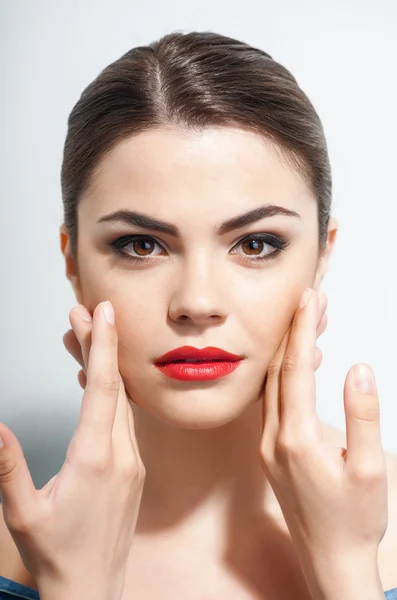 Beautiful young girl is after doing make-up — Stock fotografie