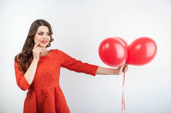 Pretty young woman is giving someone present — Stock Photo, Image