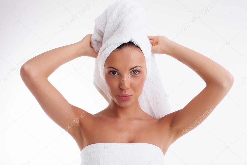 Cheerful young girl after having fresh shower