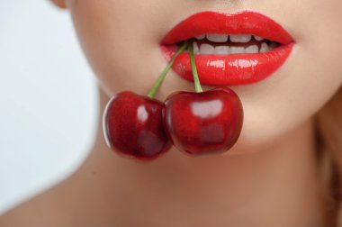 Attractive young woman with appetite sweet merry