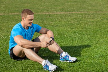 Handsome young man is resting after training