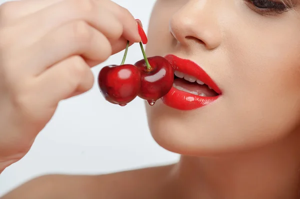 Beautiful young girl with red sweet cherry — Stok fotoğraf