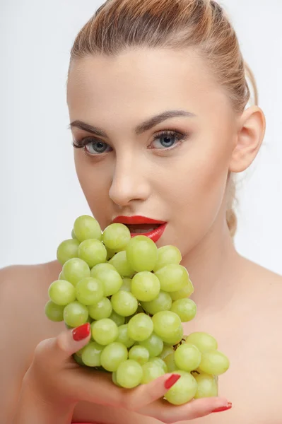 Cheerful young girl with fresh green fruit — Stok fotoğraf