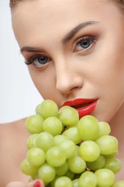 Attractive young woman with juicy sweet food — Stok fotoğraf