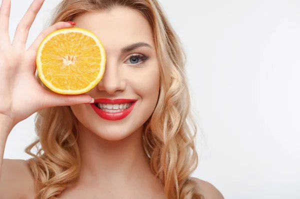 Attractive young woman with yellow fresh fruit — Stok fotoğraf