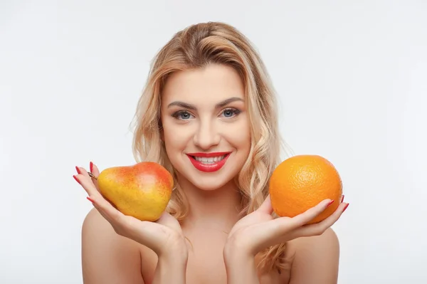 Beautiful young woman with appetite fresh fruits — Stock Photo, Image