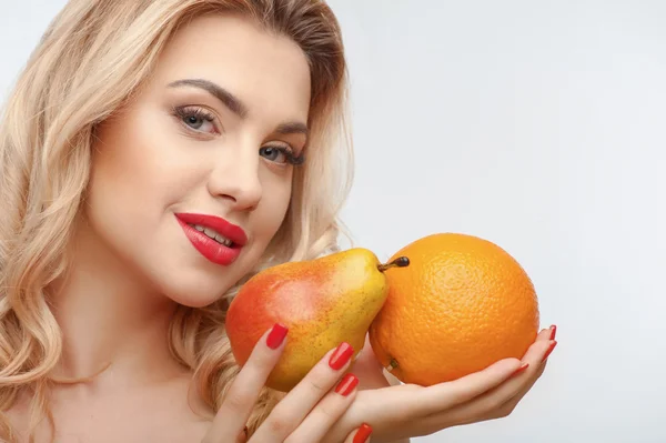 Attractive young girl with two tasty fruits — 스톡 사진