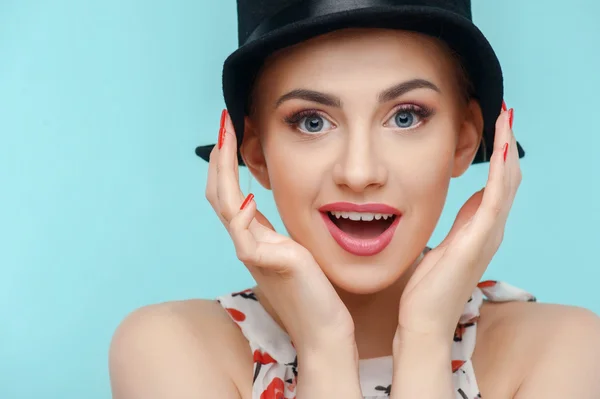 Beautiful young woman with black strange cap — 스톡 사진