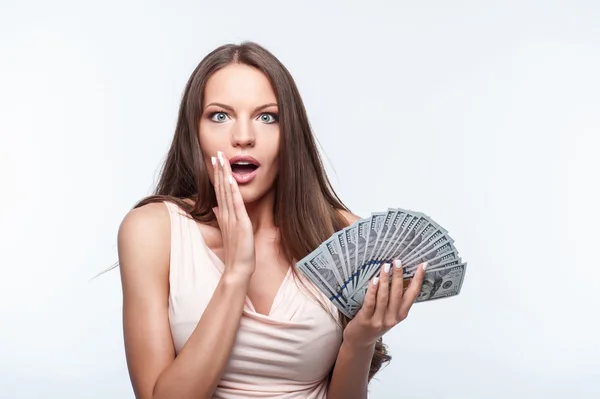 Beautiful young woman is very rich and shocked — Stockfoto