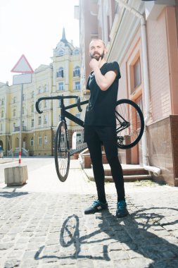 Attractive young man is walking in city
