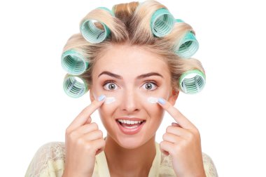 Cheerful young woman is preparing for date