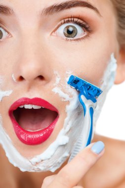 Cheerful young woman is making fun in bathroom