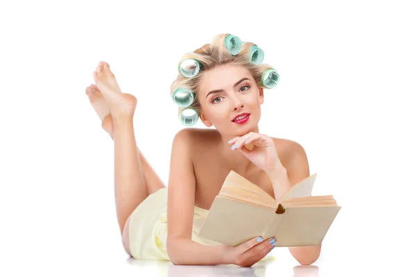 Cheerful young blond girl with curlers is relaxing — Stok fotoğraf