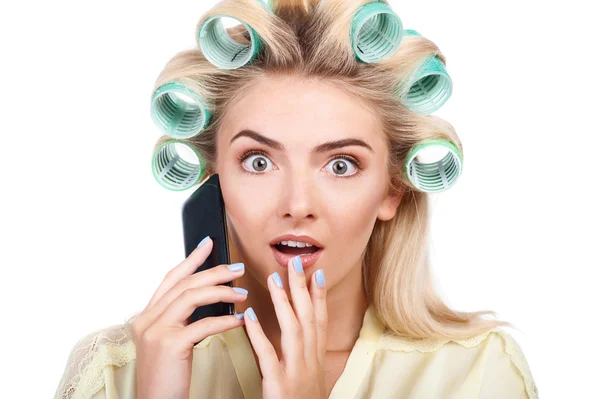 Cheerful young woman is talking on telephone — Stockfoto