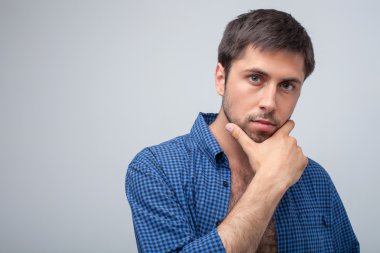 Handsome young guy is thinking about his life