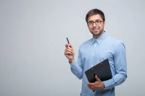Cheerful young male manager is doing his job — Stock Photo, Image