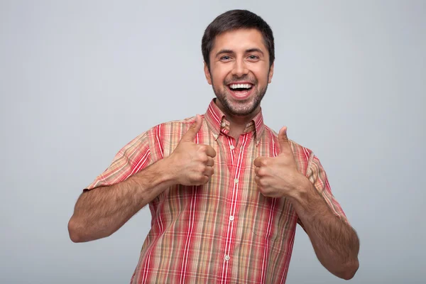 Jovem atraente está expressando emoções positivas — Fotografia de Stock