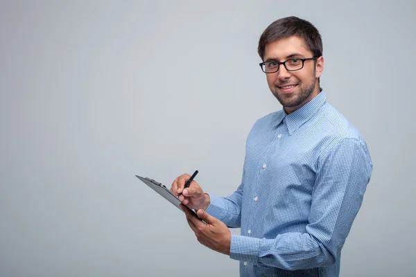 Pretty young male scientist is working with documents — Stock Photo, Image
