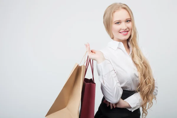 Cheerful young woman is buying new clothing — Zdjęcie stockowe