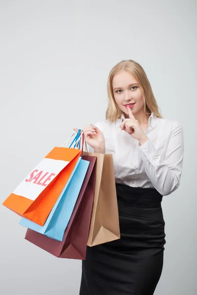 Pretty young woman is going shopping secretly — Stock Photo, Image