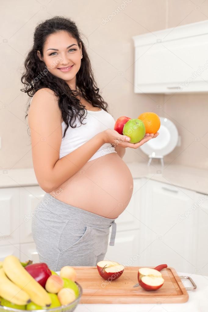 Beautiful young pregnant woman prefers healthy eating