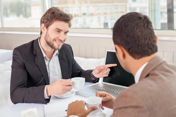 Handsome business partners are discussing a new project — Stockfoto