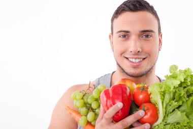 Handsome young fit guy prefers healthy eating