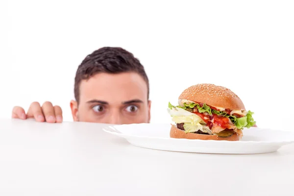 Attractive pretty young man is very hungry — Stock Photo, Image