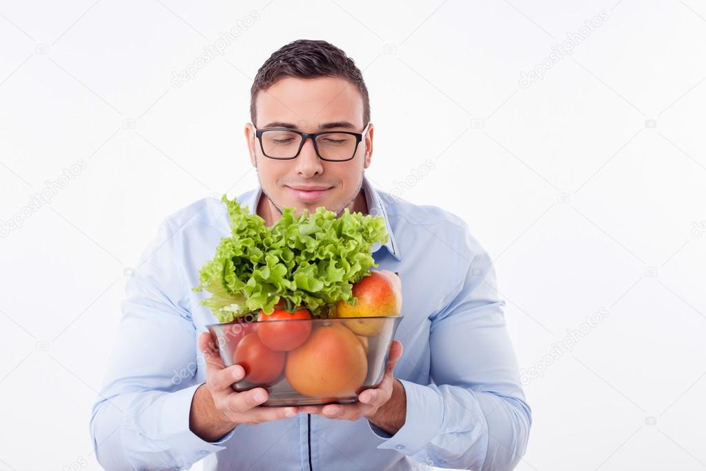 Handsome young fit man prefers healthy eating