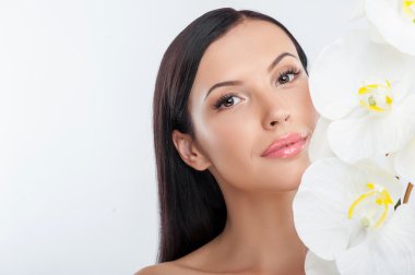 Beautiful young woman is caring of her skin