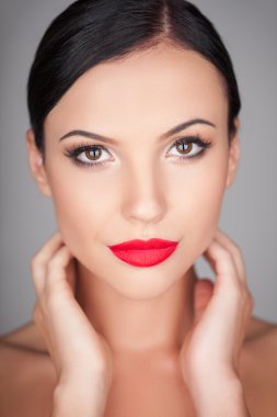 Beautiful young girl is flirting with someone