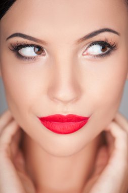 Attractive young girl is seducing and flirting