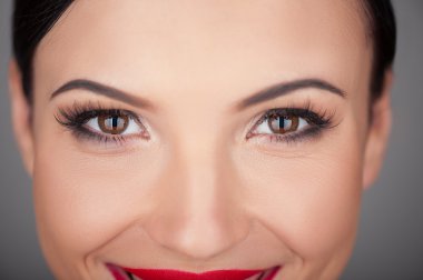 Cheerful young girl is caring of her skin