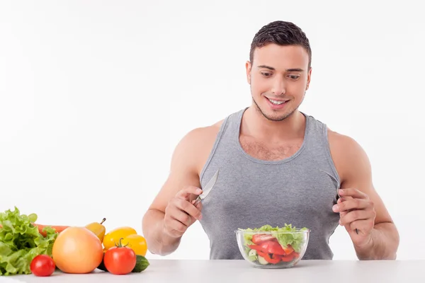 Attractive young man wants to eat healthy food — Stock Fotó