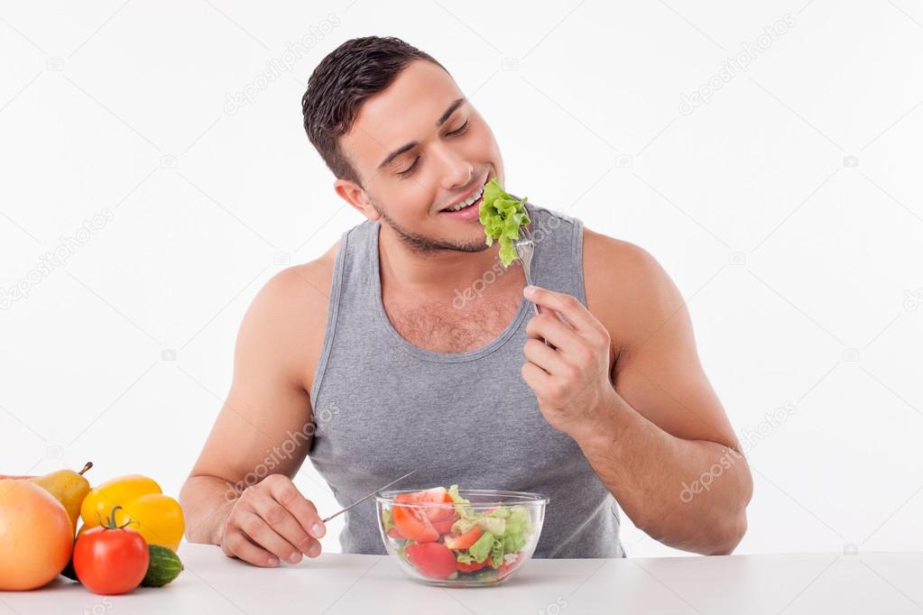 Attractive young fit guy prefers healthy eating