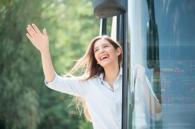 Beautiful young woman is making fun in transport