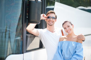 Cute loving couple is using a public transport