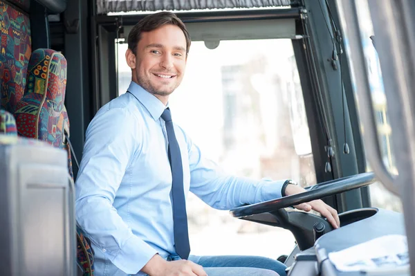 Attractive young man is driving a public transport — 图库照片