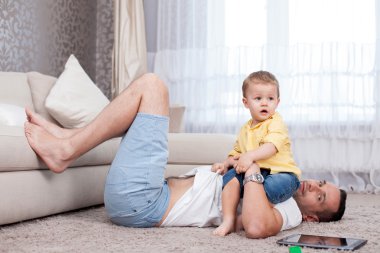 Cheerful father and son are spending time together