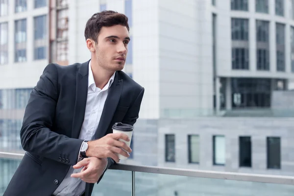 Cheerful young male worker is relaxing on break — 图库照片