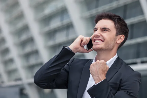 Attractive young man has succeeded in his business — Stock Photo, Image