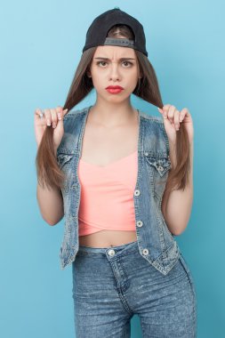 Attractive young hipster girl is expressing offence