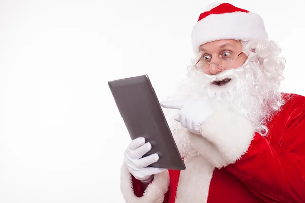 Cheerful old Santa Claus likes modern technology — Stok fotoğraf