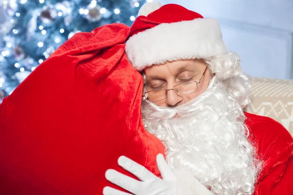 Gorgeous Father Christmas is relaxing after hard work — Zdjęcie stockowe