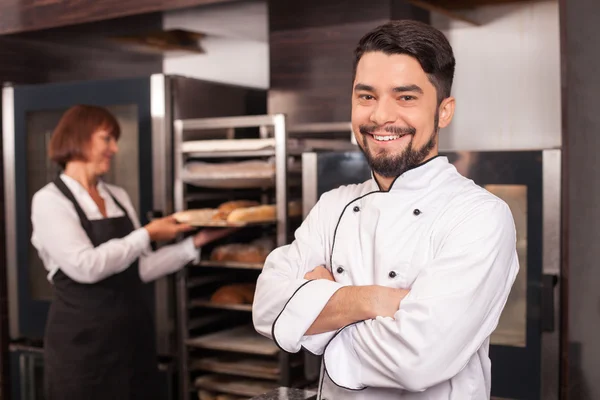 Cheerful chefs are in process of work — Stockfoto