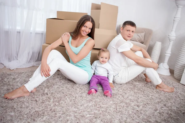 Cute family is packing objects for cross-over Stock Picture