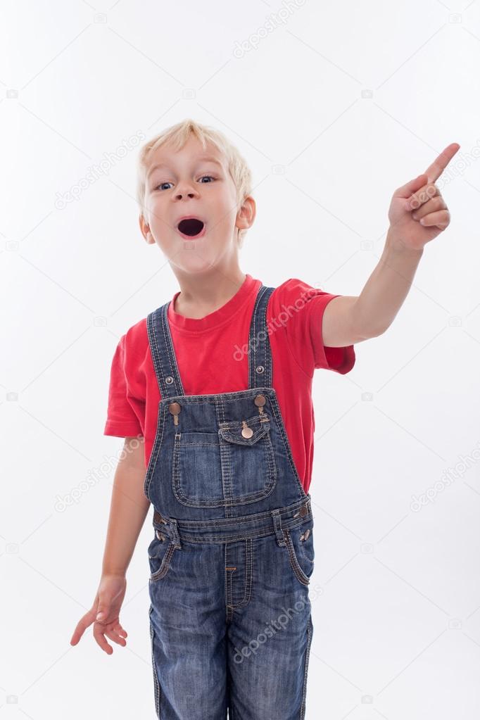 Cheerful male child is showing something interesting
