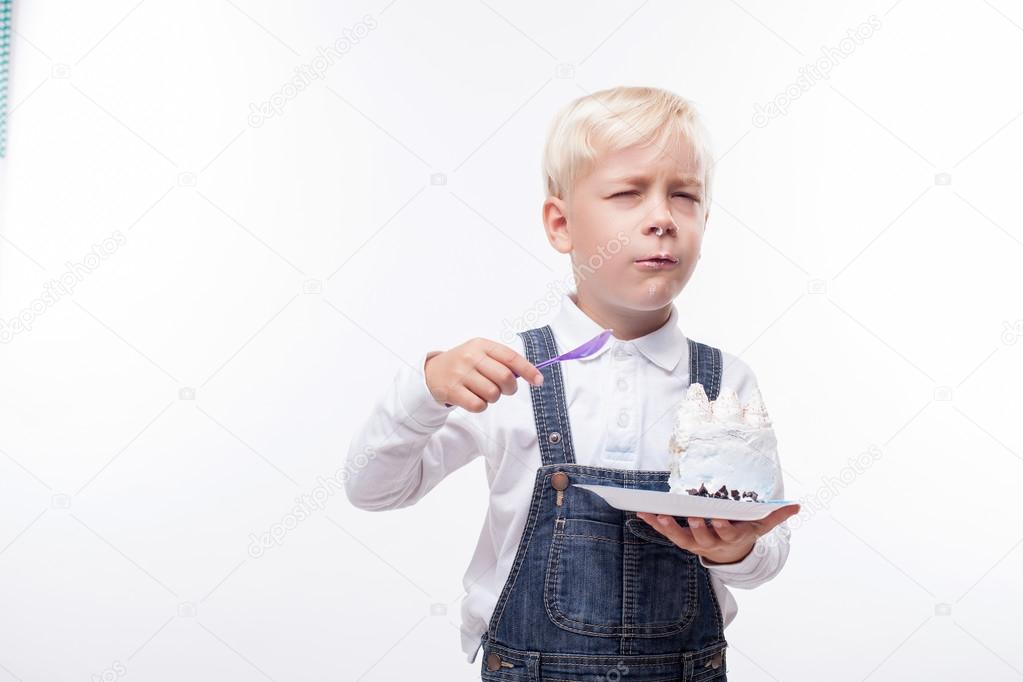 Cute male child is enjoying sweet food