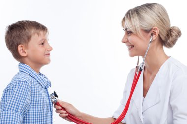 Beautiful young female pediatrician is seeing her patient